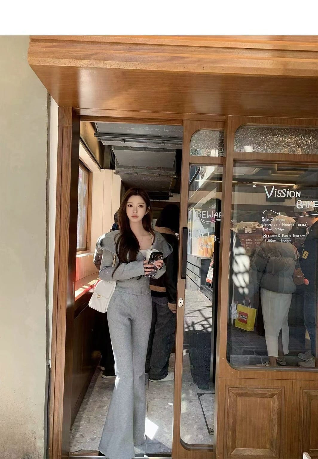 韓系慵懶收腰斜拉鍊連帽喇叭褲套裝